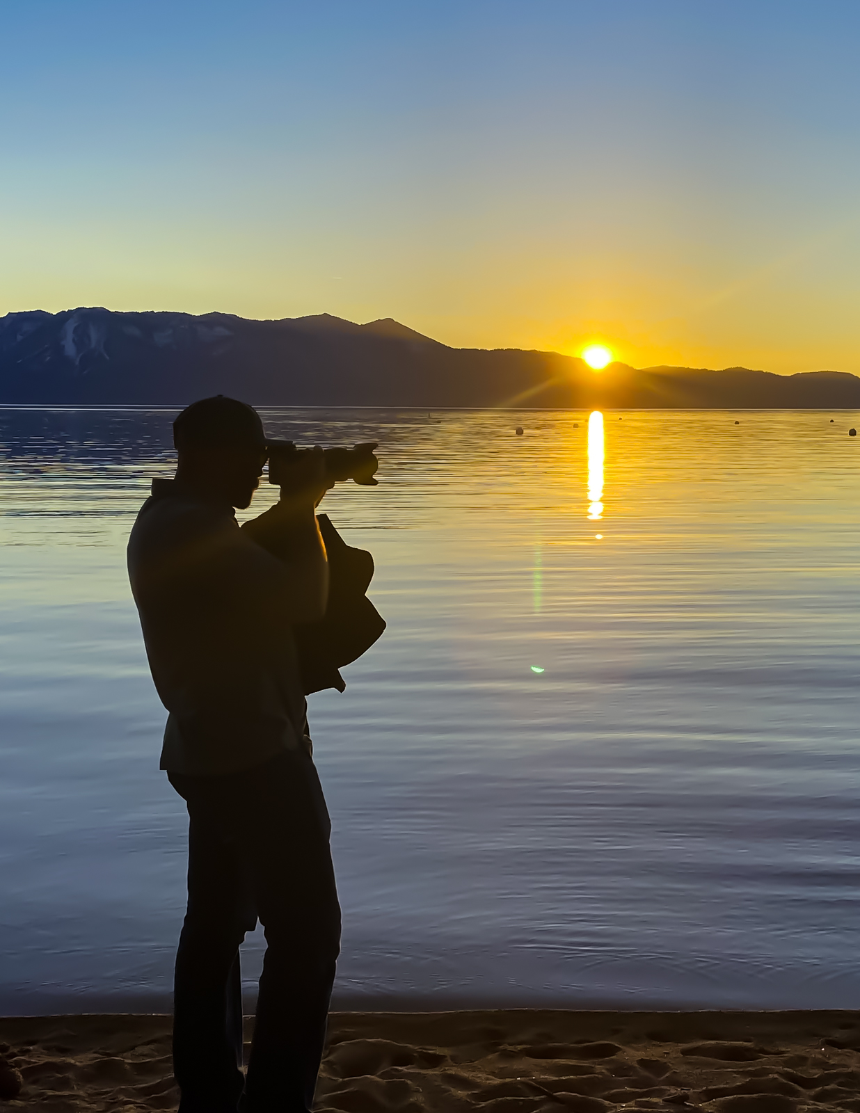 Stu Olsen photographing in the field with camera equipment